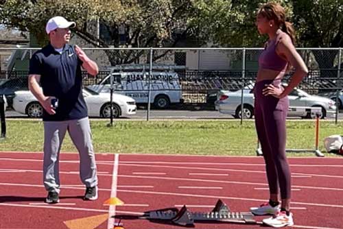 Ken Clark with Gabby Thomas on Track