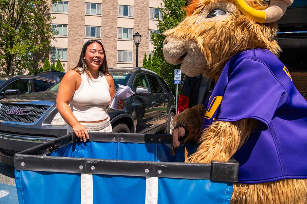 Rammy Helping Student Move In